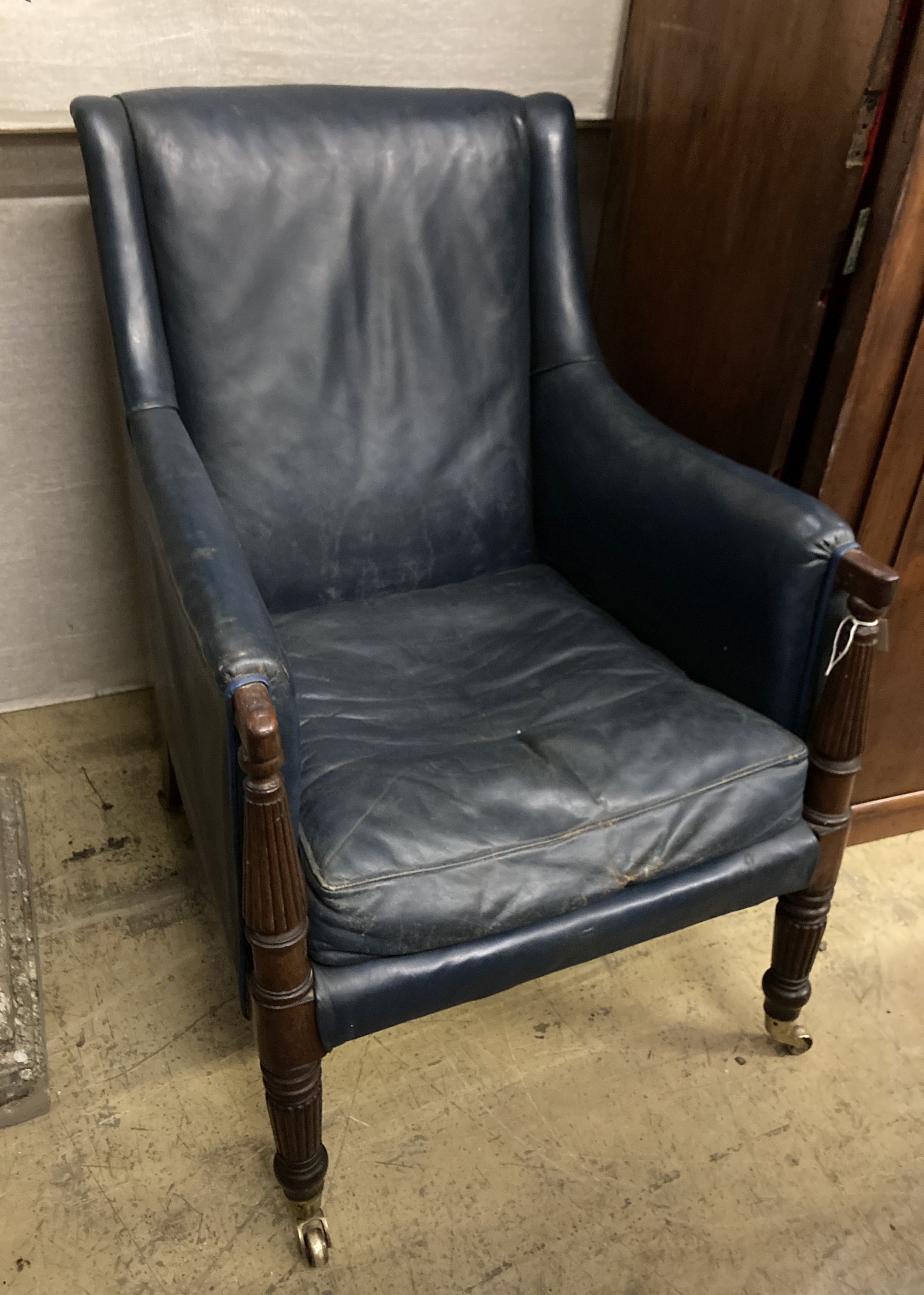 A Regency mahogany library chair, upholstered in blue leather, width 65cm depth 75cm height 93cm